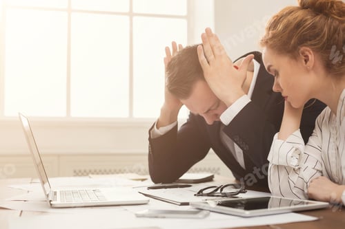 Preview: Couple of young business partners working at modern office