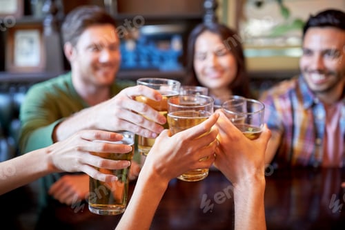 Preview: happy friends drinking beer at bar or pub