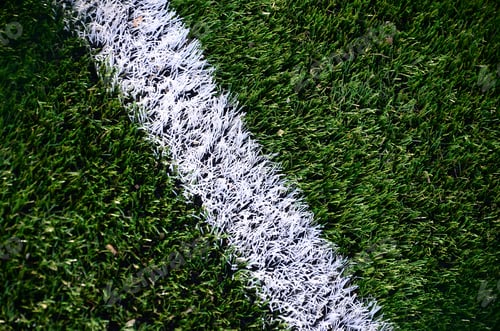 Preview: White stripe on a bright green artificial grass soccer field