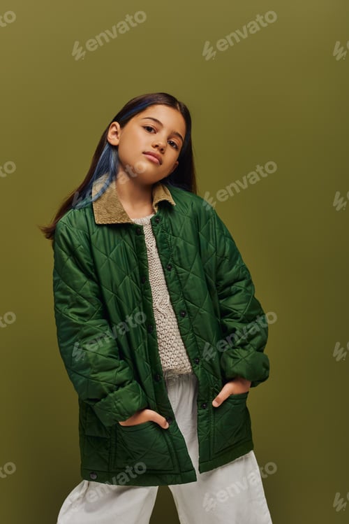 Preview: Confident and stylish brunette preteen girl with dyed hair posing in autumn outfit and knitted