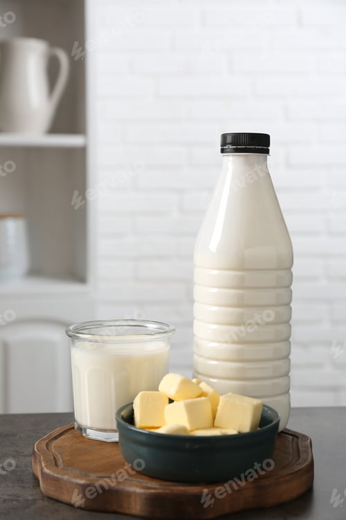 Preview: Different dairy products on gray textured table in kitchen