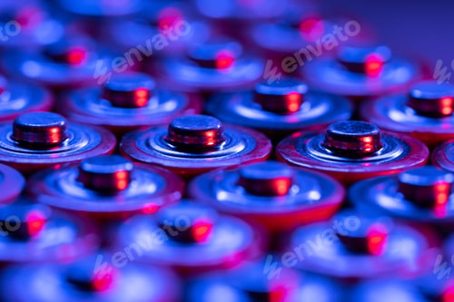 Preview: Closeup of positive ends of discharged batteries AA sizes, macro shot, selective focus. Used battery