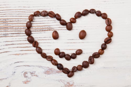 Preview: Coffee Bean Smile on White Wood Table