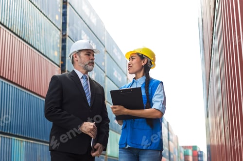 Preview: Businessman and Secretary work at Container cargo site check up goods in container.