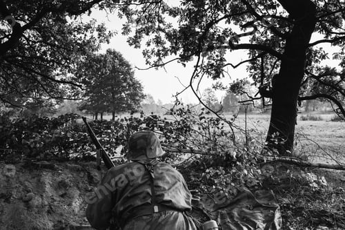 Preview: German Wehrmacht Infantry Soldier In World War II Hidden Sitting