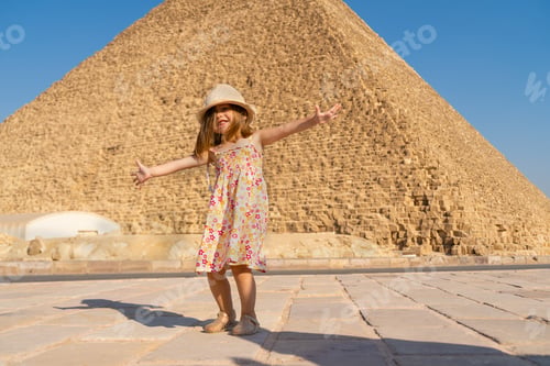 Preview: Cute little girl dancing in front of the Cheops pyramid on the Giza plateau
