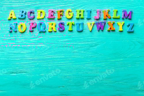 Preview: Multiple colored letters on wooden table