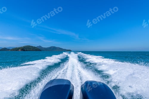 Preview: Speed motorboat engine speed fast to travel island show white splash wave foam with blue sky backgro