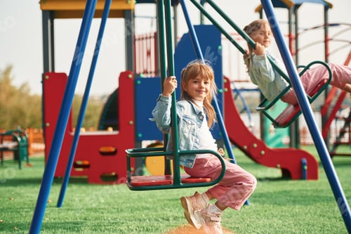 Preview: Two girls. Kids are having fun on the playground