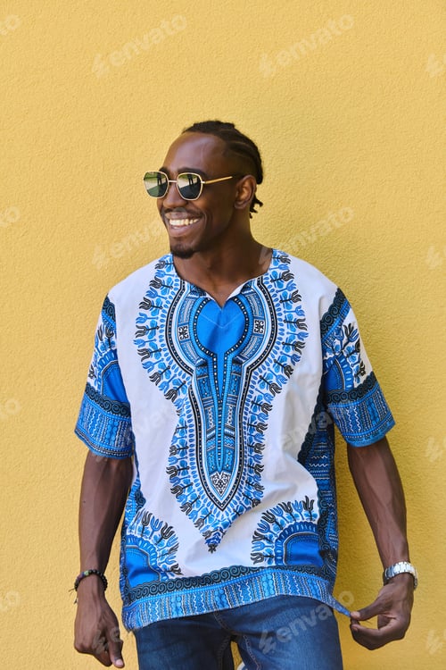Preview: Sudanese Tradition Meets Modern Youth: African American Teen in Vibrant Traditional Attire Against a