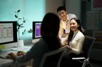 Preview: UX/UI designers collaborating on app development in office