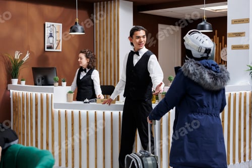 Preview: Concierge assists woman with luggage