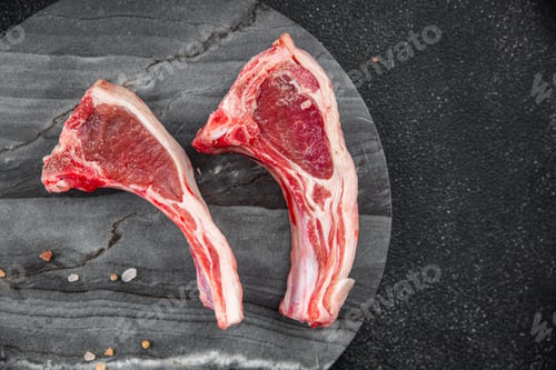 Preview: lamb raw meat cutlet on the bone slice meal food snack on the table copy space food background
