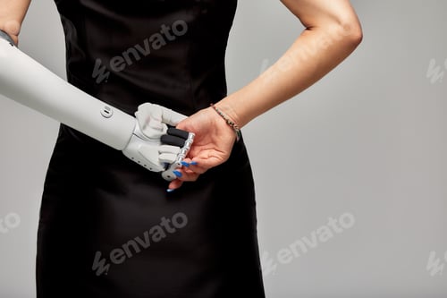 Preview: Cropped studio portrait of charming girl with disability wearing sensory bionic prosthetic arm
