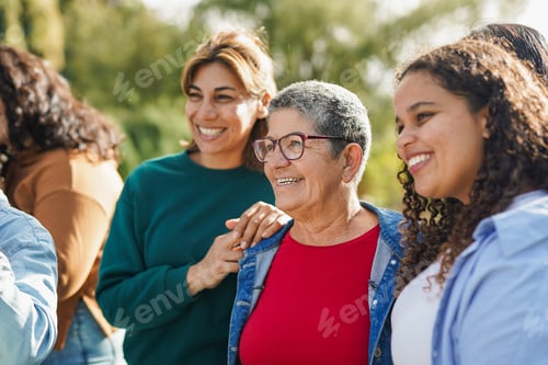 Preview: Group of multiracial women with different age meet each other at city park