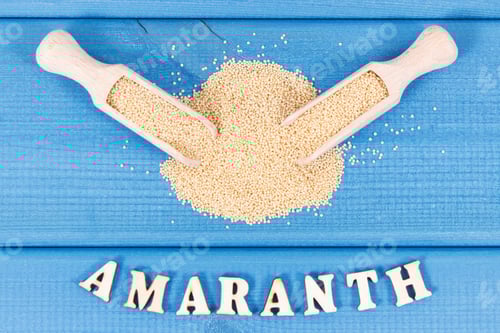 Preview: Amaranth Seeds with Wooden Scoops on Blue Wood