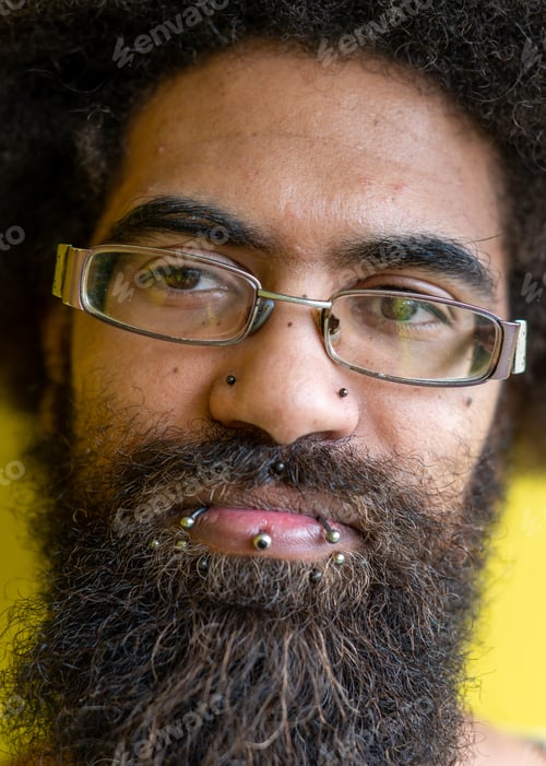 Preview: Close up shot of man with lip piercings