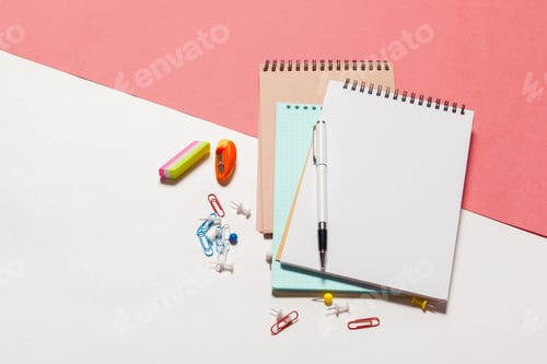 Preview: Colorful stationery arranged on a desk with various office supplies for school or work