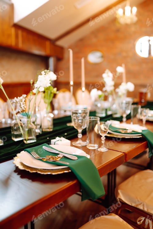 Preview: Banquet table in the restaurant, preparation before the banquet. The work of professional florists.