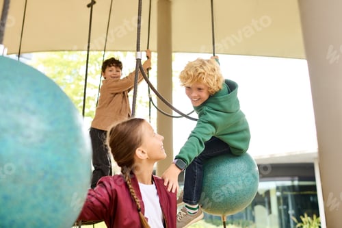Preview: Children enjoy playful moments on a sunny autumn day at the playground