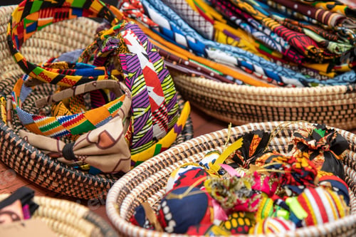 Preview: A Selection Of African Clothes And Garments Being Sold On Table