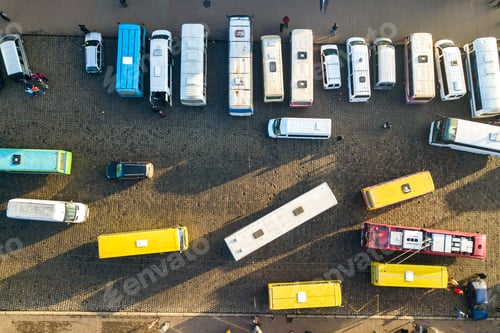 Preview: Aerial view of many cars and buses moving on a busy city street