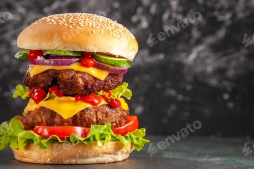 Preview: Delicious meat sandwich with tomatoes green on the right side on dark background