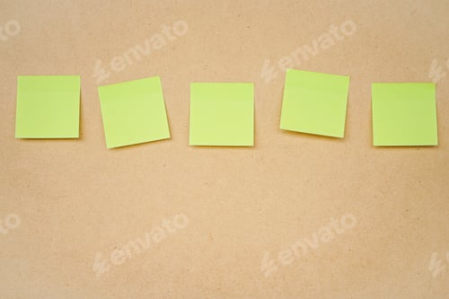 Preview: Five yellow sticky note on brown clipboard or plywood board background