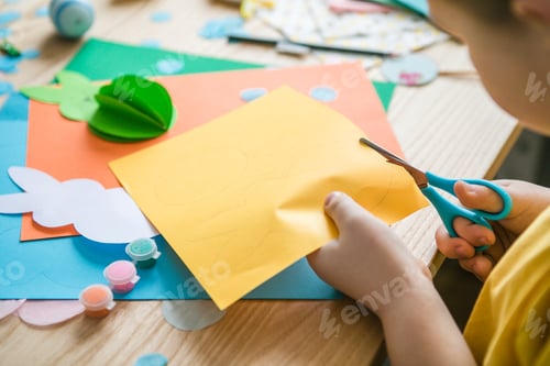 Preview: Cut out bunny blanks from multi-colored paper. Childrens handmade Easter craft, DIY