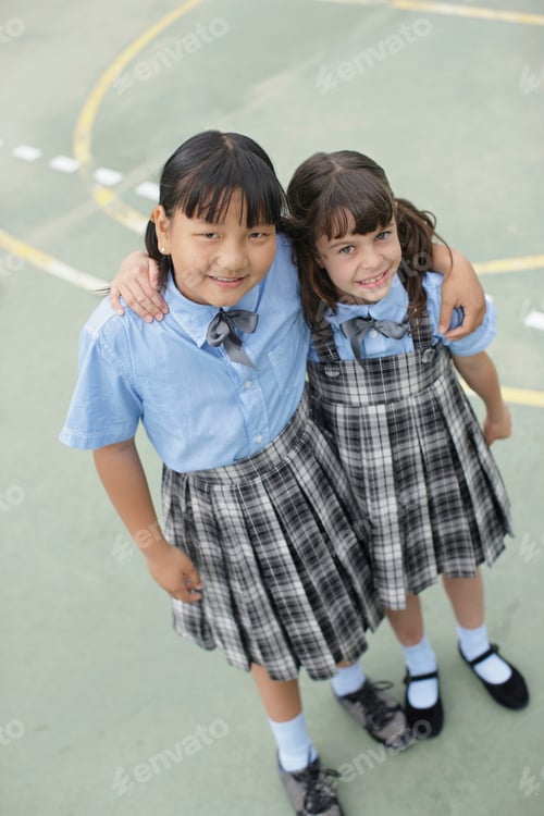 Preview: School girls hugging each other