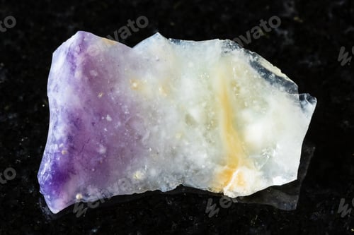 Preview: sample of rough opal mineral on black granite