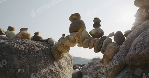 Preview: Arch of pebbles in balancing on the sea coast
