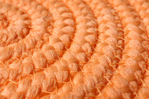 Preview: Orange wicker mat texture as background, closeup