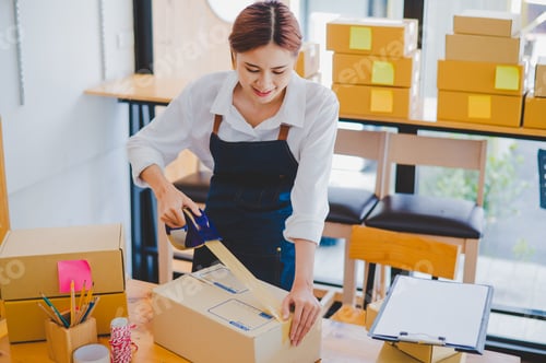 Preview: Online small business owners are packing their ordered products into the boxes for their customers