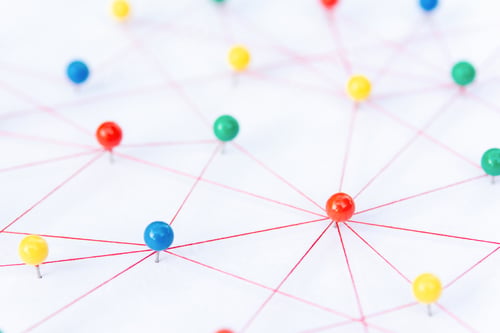Preview: The connection between the two networks. Network simulation on paper linked together by yarn