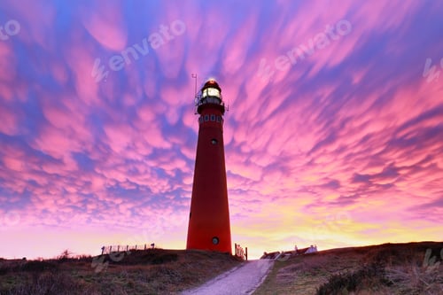Preview: spectacular purple mammatus clouds over red lighthouse