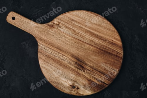 Preview: Chopping board. Empty round wooden cutting board on dark stone background