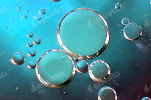 Preview: Abstract oil bubbles on a blue background. Macro photography of bubbles on the water surface.