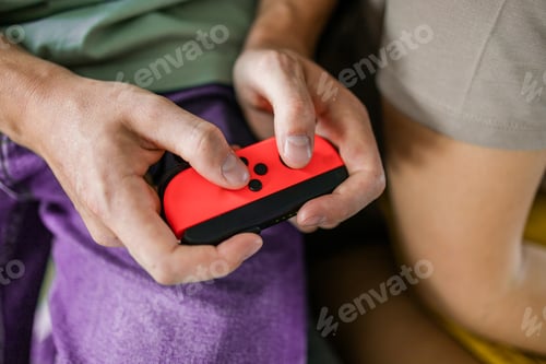 Preview: Hands using game controller. Playing video games