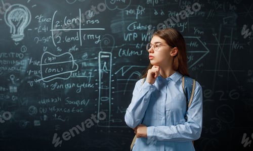 Preview: Teenager in class on background of blackboard