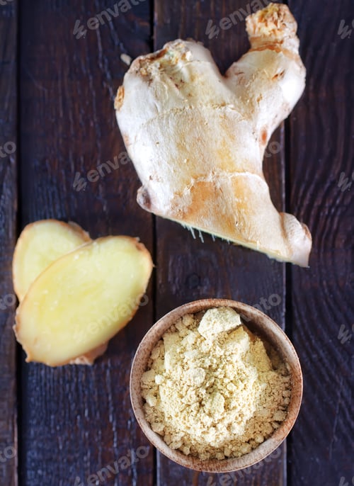 Preview: dry ginger in the wooden bowl and on a table