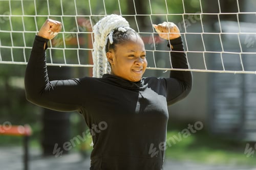 Preview: Afro-american plus size woman doing workout exercises session outdoor