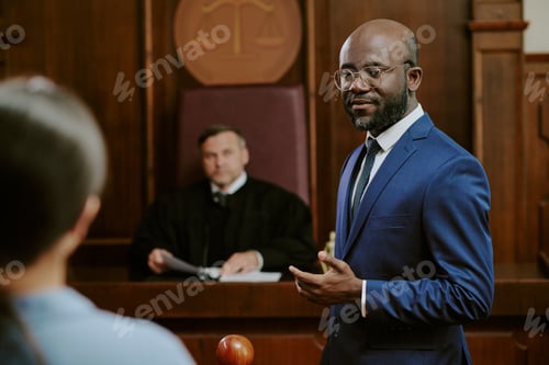 Preview: Middle Aged Black Man Addressing Courtroom during Legal Proceedings