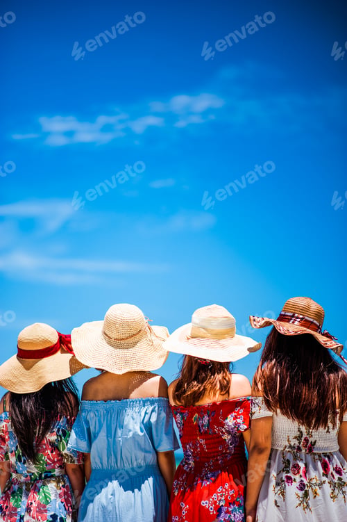 Preview: Friends at the Beach. Beautiful girls on sunny tropical beach .
