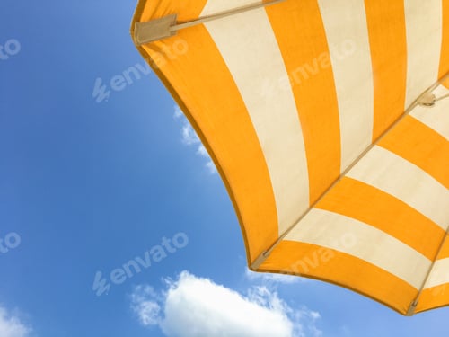 Preview: Yellow umbrella on the beach