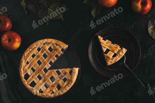 Preview: top view of piece of apple pie on cake server on plate isolated on black surface