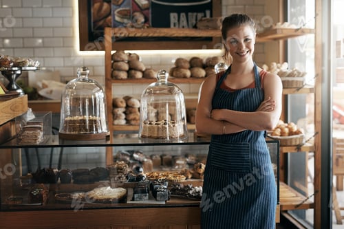 Preview: Portrait of a confident young woman working in a coffee shop
