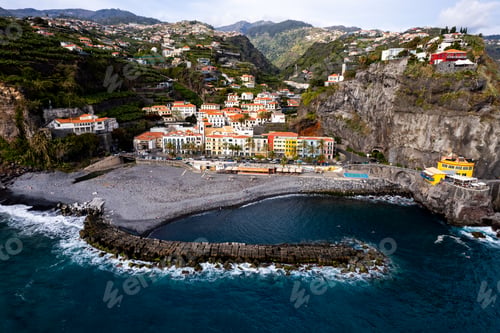 Preview: Ponta do Sol in Madeira Island, Portugal. Aerial drone view at cityscape of coastal town and beach