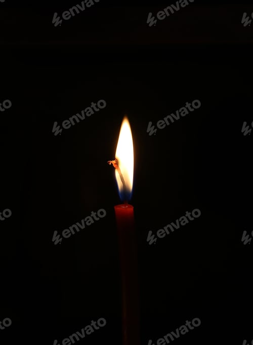 Preview: Burning candle in the dark