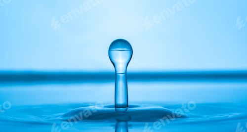 Preview: Water drop splashing into blue water surface